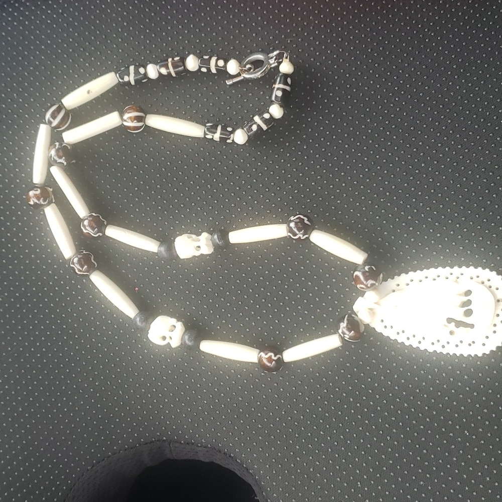 Ivery and bone beaded necklace and pendent